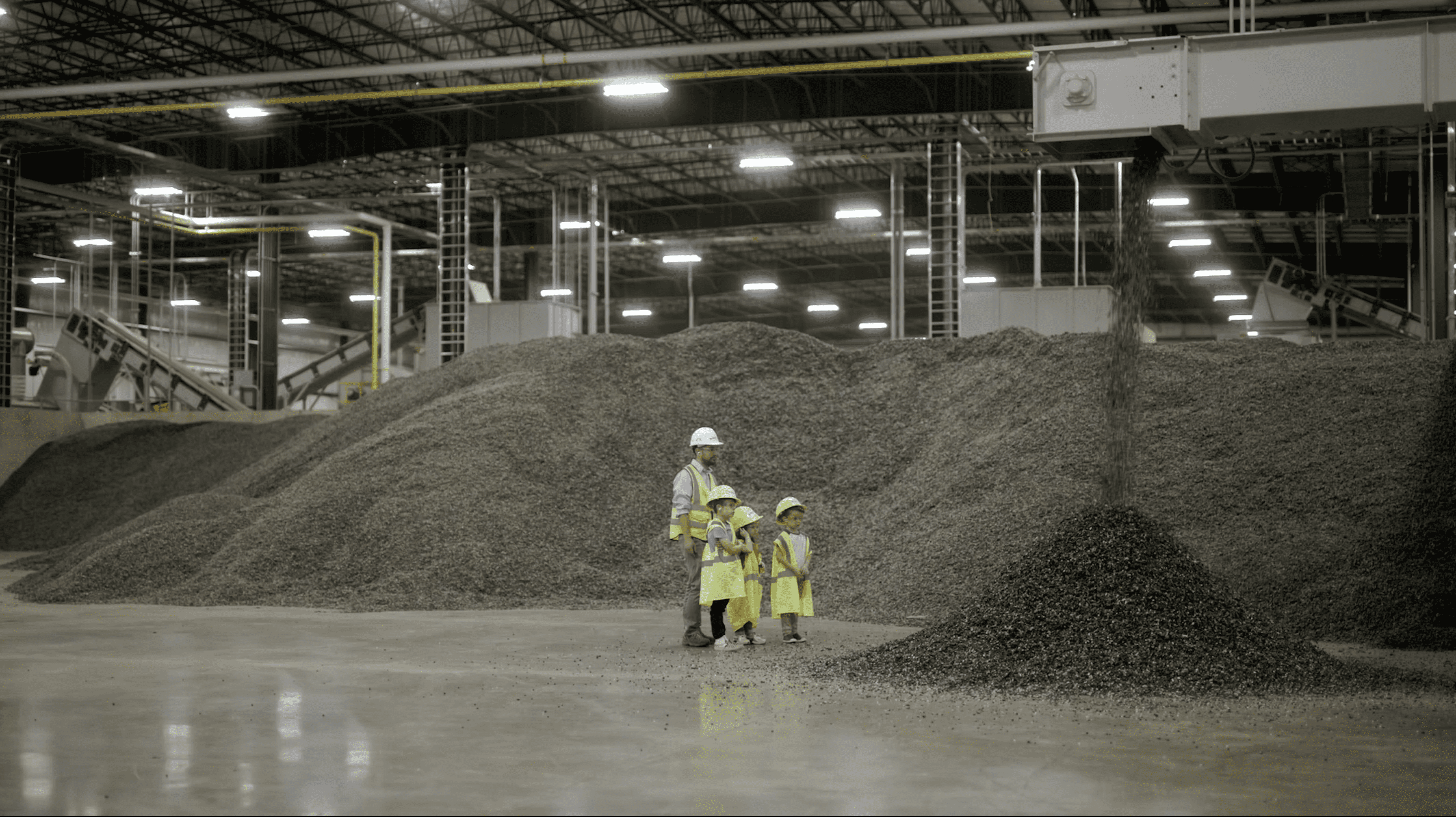 Man with two kids at plastics facility