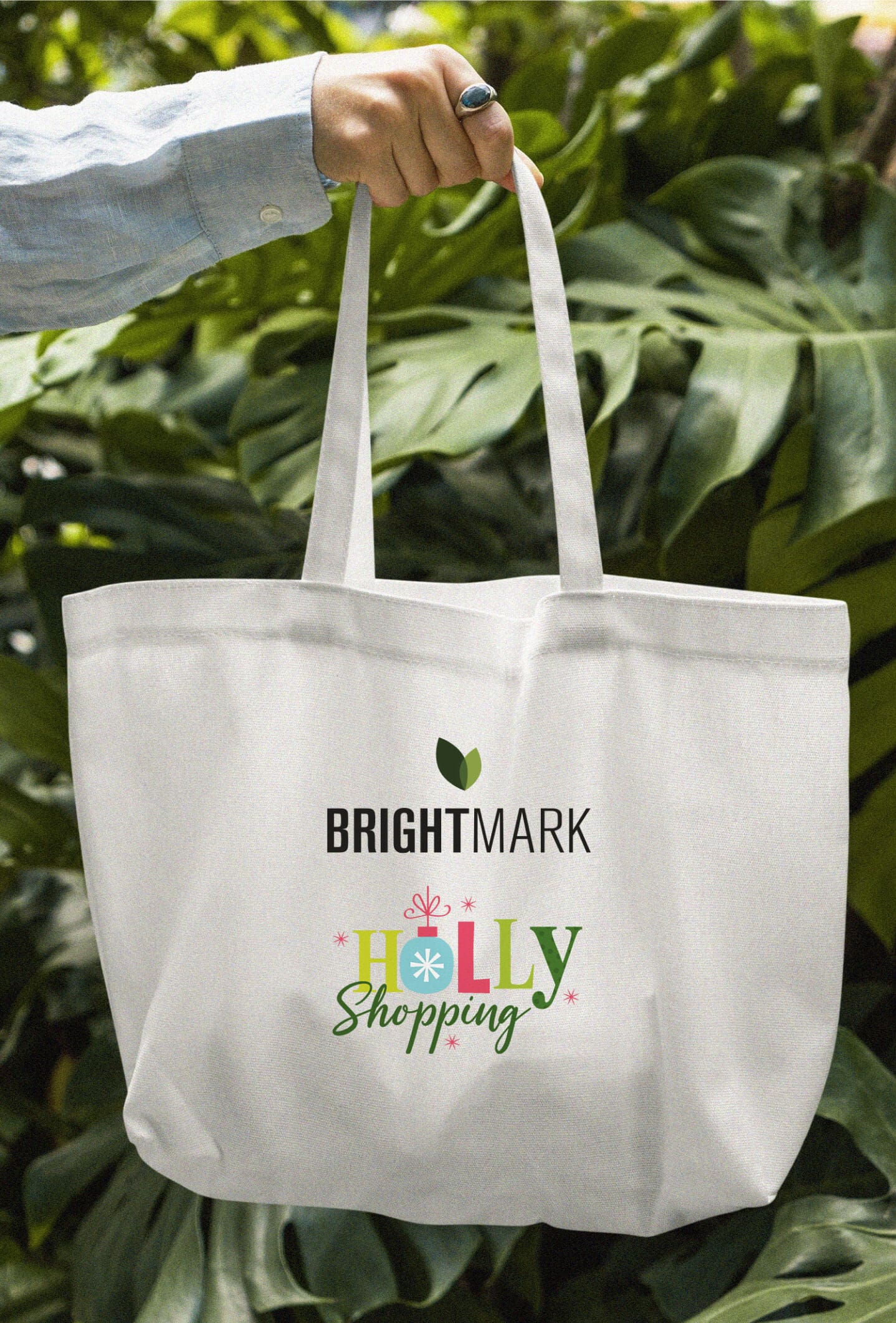 Canvas tote bag with the Brightmark and Holly Shopping logo